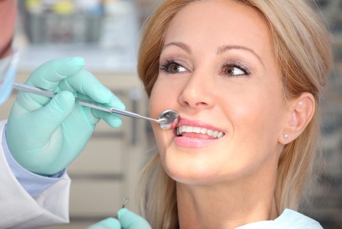 close up portrait of a woman having a dental exam